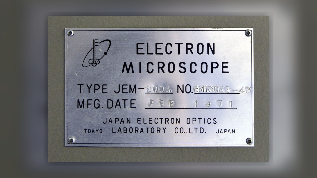 Japanese machine nameplate on older industrial equipment